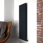 Black modern radiator. Stylish heating solution in contemporary interior design.