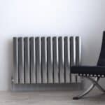 Radiator heater in modern minimalist room, sleek metal design for heating and decor.