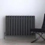 Modern black radiator with sleek design for home heating solutions.