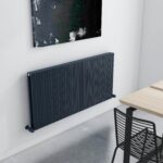 Sleek black modern radiator in contemporary interior design setting.