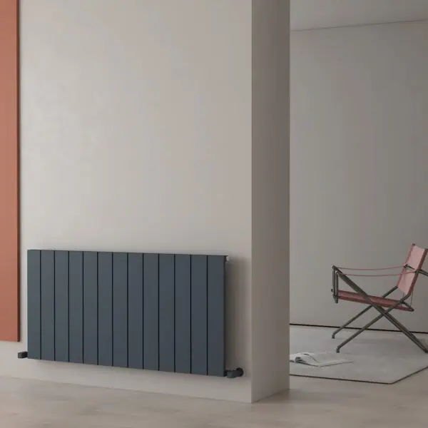 Radiator heating panel mounted on wall in modern interior.