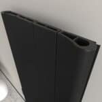 Black modern radiator, sleek design and efficient heating solution for contemporary interiors.