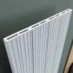 Aluminum radiator panel with vertical fins for efficient heat dissipation.