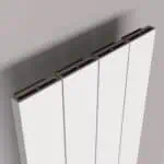 Modern panel radiator with black trim, white finish, sleek design, wall-mounted heating solution.