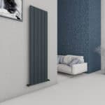 Radiator heater in modern interior living room with navy brick wall and white sofa.