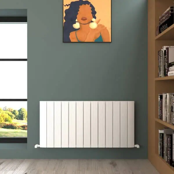 Radiator heating panel in modern interior room with bookshelf and artwork.