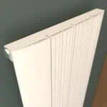 High-quality modern vertical radiator with sleek white finish for home heating solutions.