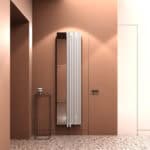 Radiator with integrated mirror in modern home interior, stylish heating solution, warm brown walls, terrazzo floor.