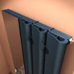 Modern black oil radiator heater close-up showing adjustable knobs and design features for effective heating.