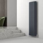 Radiator for modern interior heating, black vertical panel heater, stylish home decor element.