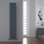 Vertical modern radiator in a contemporary interior setting.