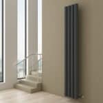 Black modern radiator in minimalist interior, ideal for contemporary home heating solutions.