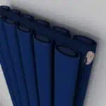 Blue radiators with circular vents for heating system.