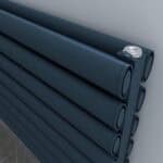 Flexible black piping rolls for plumbing or irrigation systems, close-up image.