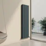 Modern vertical electric radiator in a contemporary living space with city view.