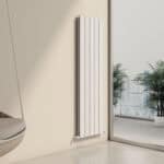 Modern vertical panel radiator in a contemporary interior setting.