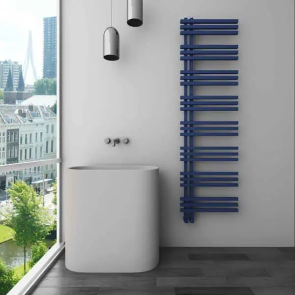 Contemporary bathroom with modern radiator and round freestanding bathtub in a cityscape view.
