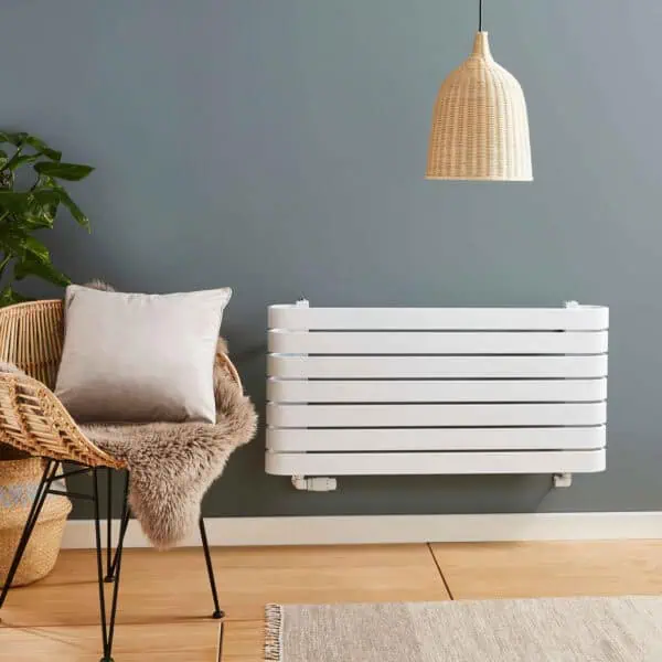 Modern wall-mounted radiator in a stylish interior setting.