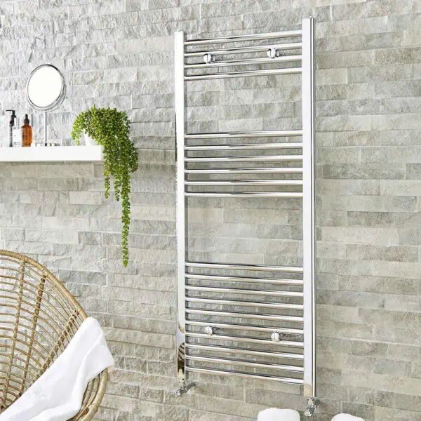 Polished chrome towel radiator in modern bathroom setting.