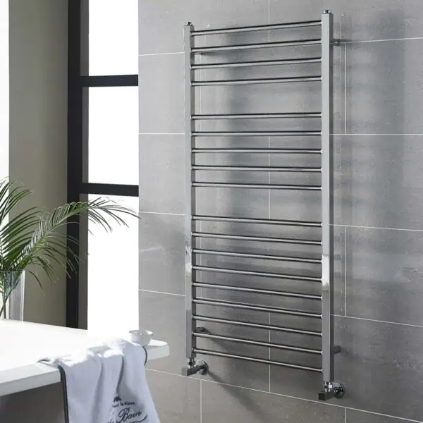 Polished stainless steel towel radiator for modern bathroom heating solutions.