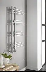 Sleek modern chrome towel radiator in a contemporary bathroom, ideal for heating and drying towels.