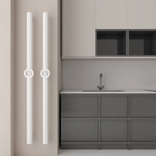 Radiator and modern kitchen interior with gray and white cabinetry and sleek fixtures.