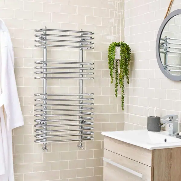 Chrome towel radiator for bathroom heating and drying.