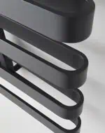 Modern black and silver heated towel rack for bathroom decor and functionality.