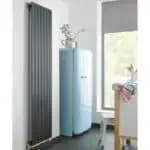Radiator and vintage refrigerator in modern kitchen, minimalist interior design.
