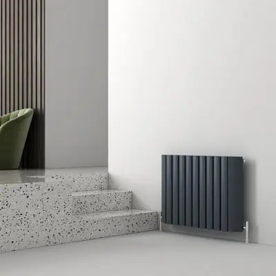 Contemporary black vertical radiator in modern interior design.