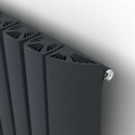 Modern black radiator with sleek design and fan-assisted heating for efficient warmth.