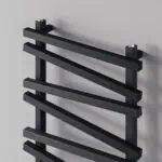 Black modern radiator wall heater for bathroom or living room, sleek and stylish design.