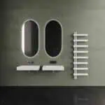 Minimalist bathroom with sleek mirrors and modern sinks for contemporary interior design.