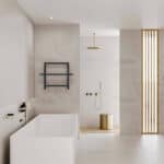 Sleek modern bathroom with minimalist design, featuring a white bathtub, gold fixtures, and wooden accents.