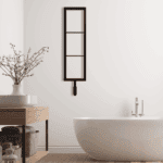 Black modern wall-mounted shelving unit in a stylish bathroom setting.