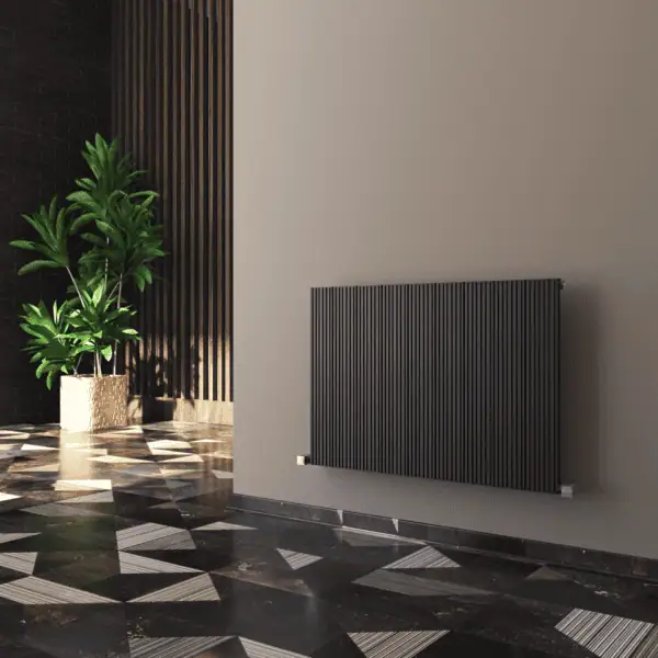 Radiator installation in modern interior with decorative wall and plant decor, stylish heating system design for homes or offices.