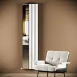 Mirror with modern frame in stylish living room setting.