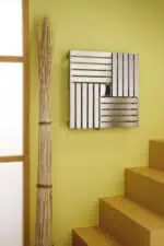 Modern wooden radiator cover with sleek silver finish, stylishly complements interior decor.